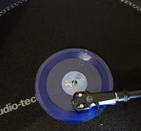 Twice Ten: The Story Goes On Tiny Vinyl Edition (Target Exclusive) - shown on a record player to demonstrate the tiny scale of this album